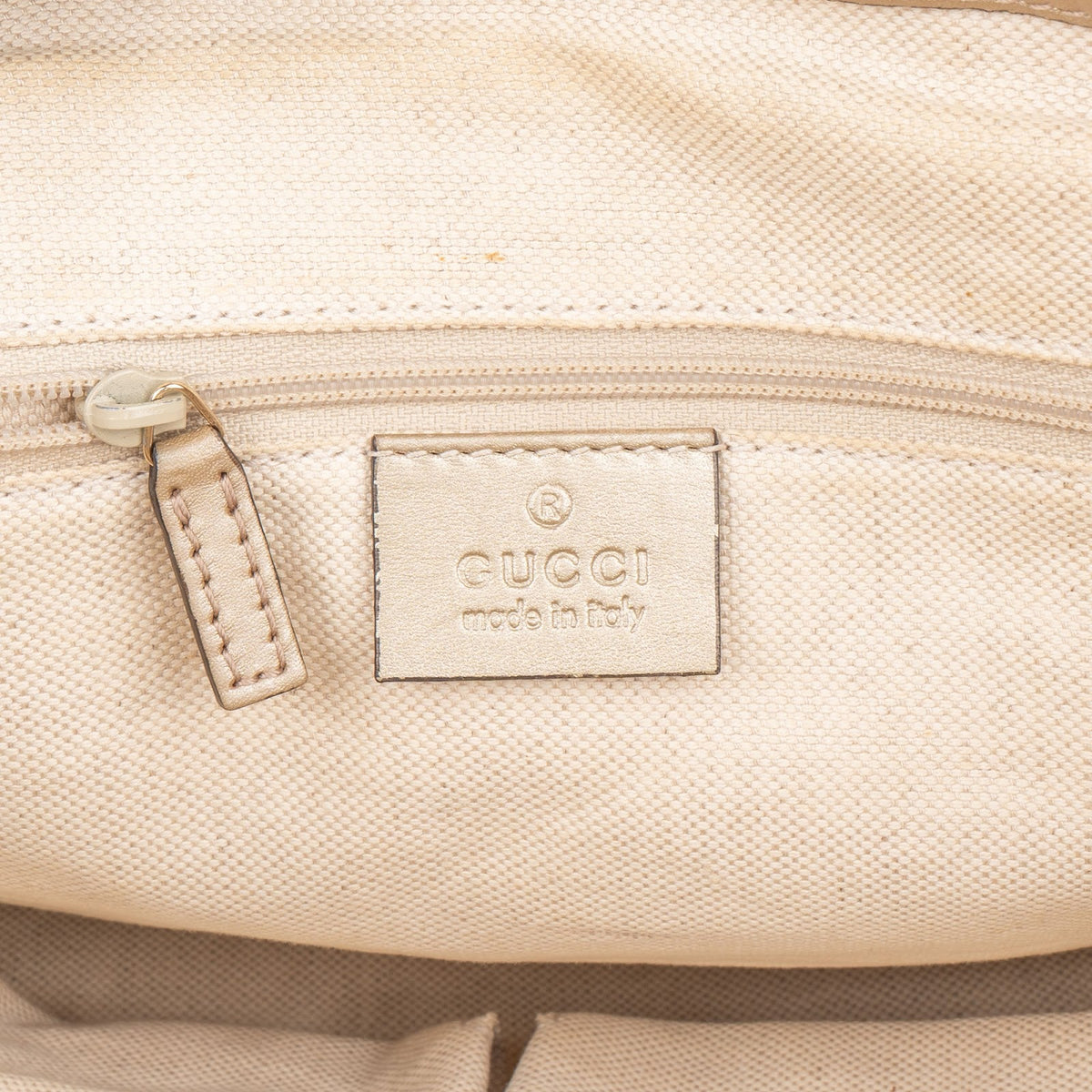 Gucci Monogram GG Canvas Metallic Leather Sukey Handbag