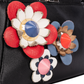 Fendi – Mini-Peekaboo-Handtasche aus schwarzem Leder mit Blumenmuster